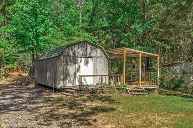 View of outdoor structure with a yard