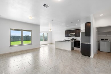 High ceilings and large windows only enhance the bright and airy feel of this open concept design!