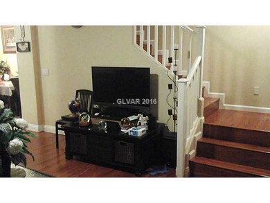 Property Photo. Part of LR w/ Stairwell in the bac