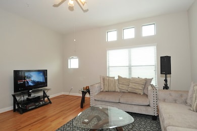 Get cozy in this spacious living room with wood fl
