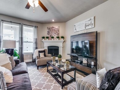Gorgeous family room includes cast stone fireplace.