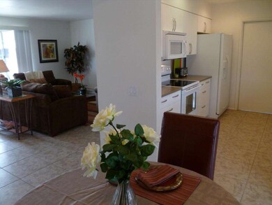 View of living and kitchen from dining