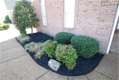 Professional landscaping gives the front character.