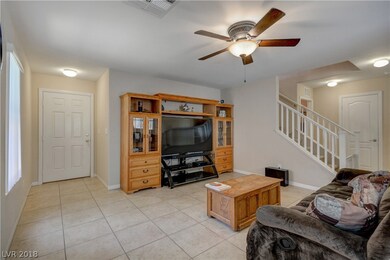 The great room features tile flooring and upgraded