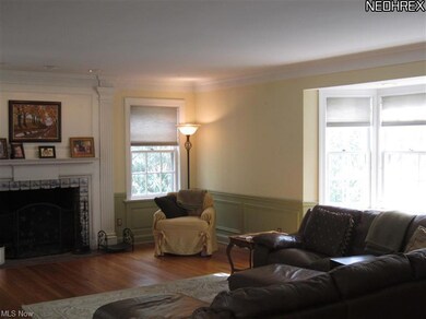 Living Room with large windows and Delft tile fire