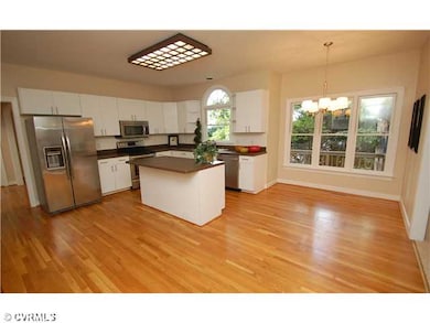 Kitchen - Eat-in kitchen with hardwood, island, ti