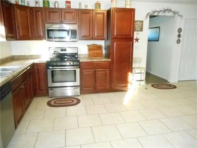 Kitchen: Efficiently designed with ample storage a