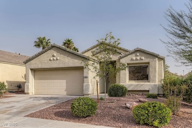 View of front facade featuring a garage, concrete