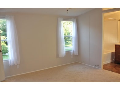 Master Bedroom. 2 windows complement the bright ma
