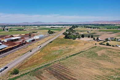 Aerial view of sparsely populated area featuring a mountainous background