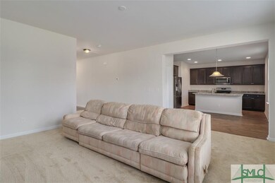Living room opens to kitchen
