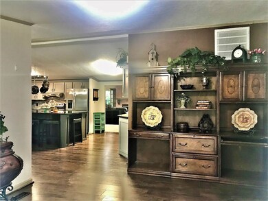 From the front door you'll arrive at a spacious entry room dividing the living & bedroom areas. This 14.9 x 12.7 space has plenty of room to pull double duty as a home office hub.