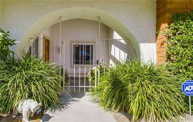 Gated archway at covered front porch
