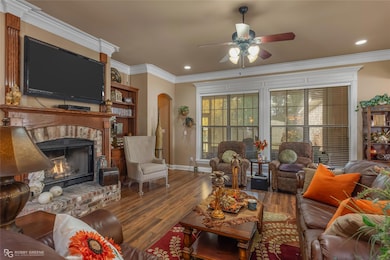 Living room with a brick fireplace, ornamental mol