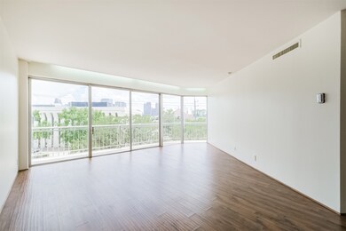 Wall of windows leading to balcony.