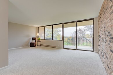 Spacious Living Room with a wall of windows and sl