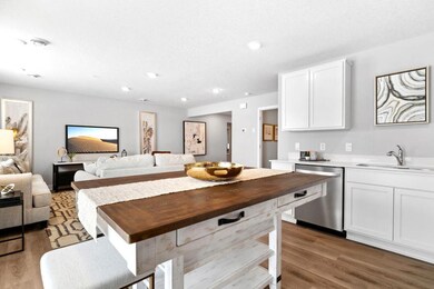 Open concept living with many ways to arrange furniture. Photo is of model home. Colors and options may vary. Ask Sales Agent for details.