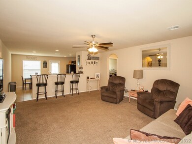 Spacious living open to kitchen, breakfast bar and