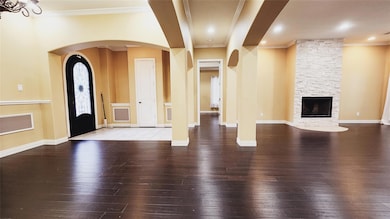 Foyer with hardwood / wood-style flooring, crown m