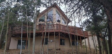 Back of property with a wooden deck