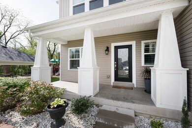 Meticulous curb appeal with beautiful covered porc