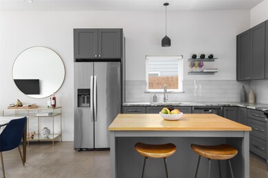Kitchen featuring dishwashing machine, butcher bl