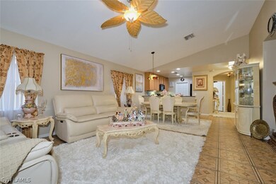 Living room with light tile patterned floors, loft