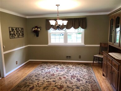 Formal dining room with chair rail & crown molding