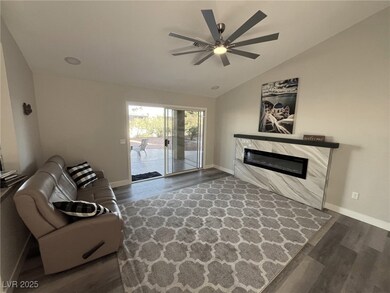 Fantastic Living Room opens to beautiful patio. TV cable connection and plug behind picture above fireplace