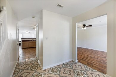Hallway featuring light wood-type flooring, basebo