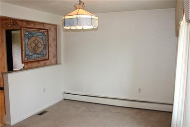 Dining room is open to the adjacent kitchen.