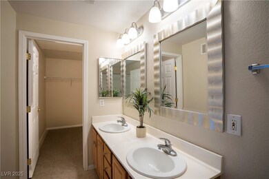 Bathroom featuring tile patterned floors, baseboar