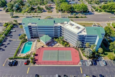 Drone / aerial view of a pool and apartment complex
