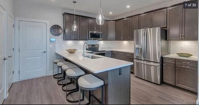 Kitchen with stainless steel appliances, a sink, a