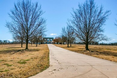 Trees and entire front of the 13 acres is irrigated. Majestic tree-lined driveway feels like home from the very beginning.