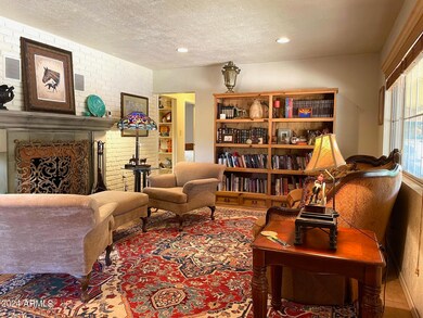 Living room with wood burning fireplace