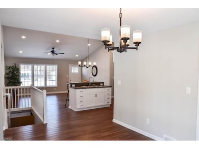 The dining room opens to the kitchen and living ro