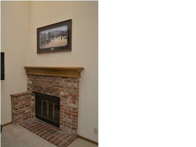 All brick wood burning fireplace and accent mantle