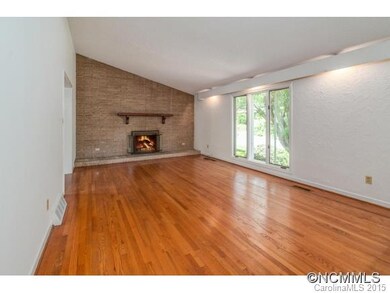 Living room with brick fp