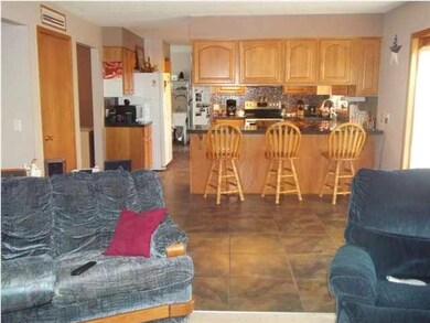 View of kitchen and eating area from living room. 