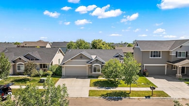 View of front of house with driveway and a residential view