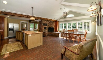 Keeping Room Features a Brick Wood Burning Firepla