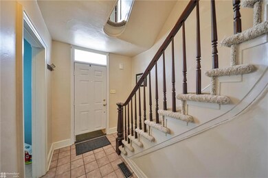 Front Foyer with Curved Staircase