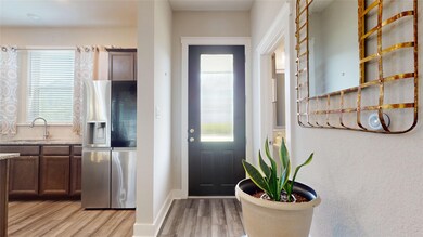 Step into an inviting entryway featuring elegant f