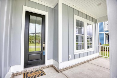 View of exterior entry featuring a porch