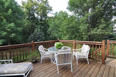 Tree-lined yard offers privacy.