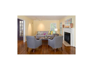 Inviting living room features classic fireplace & 