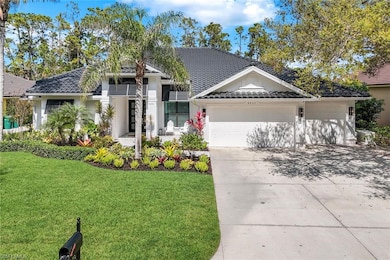 Single story home featuring a tile roof, stucco si