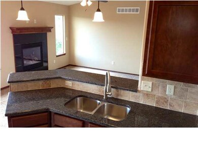 Open floor plan with kitchen overlooking the famil