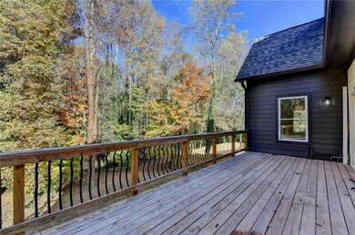 Deck featuring view of wooded area